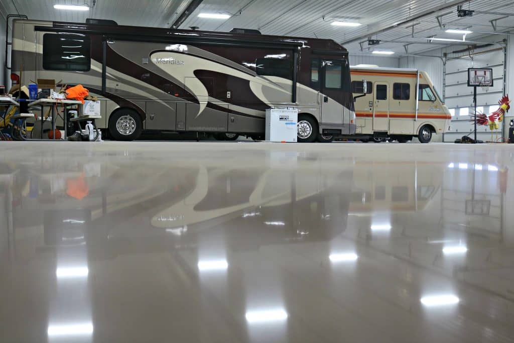 Image of a polished concrete garage floor with a glossy, reflective surface