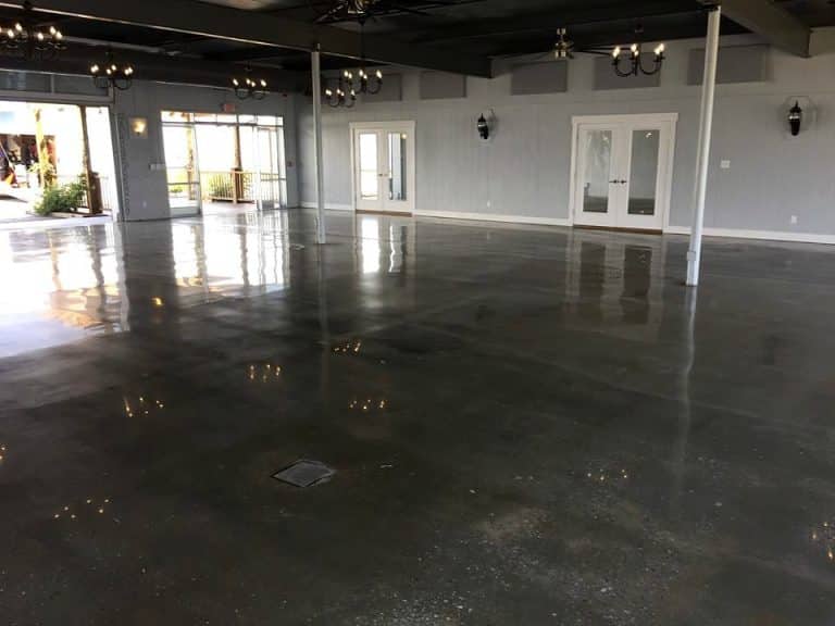 Image of commercial polished concrete flooring with a glossy, reflective surface and intricate patterns, creating a sleek and modern look for the commercial space.