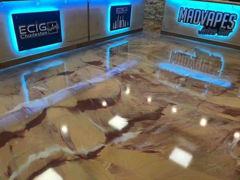 Image of a retail floor with a Metallic Marble Epoxy flooring system. The flooring features a glossy, reflective surface with natural variations in color and texture, providing a durable and attractive surface for high-traffic areas.